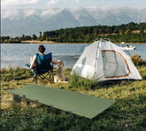 lit-de-camp-exterieur-pres-lac