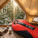 sac-de-couchage-grand-froid-femme-dort-dans tente SAC DE COUCHAGE GRAND FROID