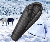 sac-de-couchage-grand-froid-le-synthetique-devant-tente SAC DE COUCHAGE GRAND FROID