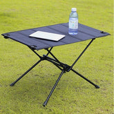table de camping noir poser cellulaire